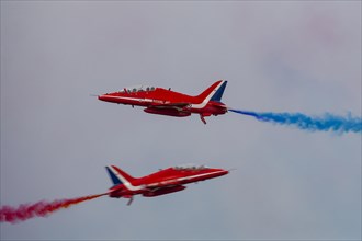 BAE Systems Hawk two aircraft of the Royal Air Force Red Arrows display team in flight