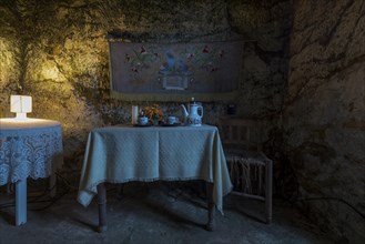 Set table and chair in a cave dwelling