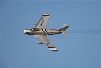 North American F-86 Sabre aircraft in flight in United States Airforce markings