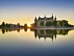 The Schwerin Castle at the Schwerin Lake at sunrise