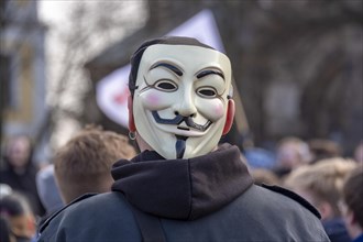 Man with anonymous mask at a demonstration