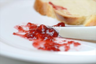 Jam and slice of braided butter