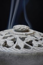 Incense burner with smoke