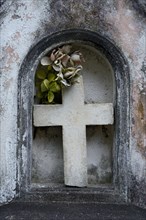 Stone cross in gravestone