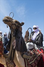 Colourful camel riders at a tribal festival
