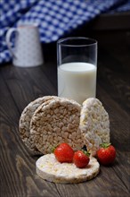Corn-Rice and spelt wafers with glass of milk and strawberries