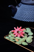 Wasabi peanuts and candied hibiscus flower