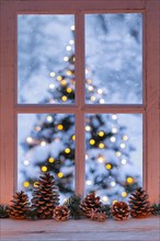 Window with view of illuminated Christmas tree