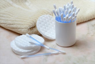 Cotton swabs and cotton pads