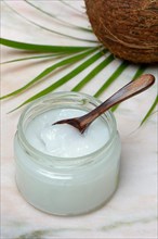 Coconut oil with wooden spoon