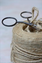 Roll of jute string and scissors