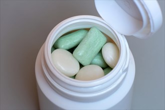 Various chewing gums in containers