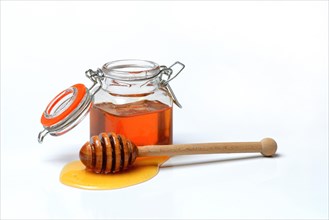 Honey in jars and honey spoon