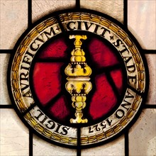 Seal of the guild of goldsmiths from 1527 as stained glass window in the town hall