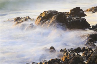 Rocks and waves on the sea coast near Bamburgh
