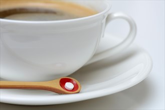 Sweetener tablet and coffee cup