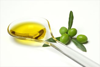 Olive oil in salad spoon