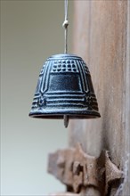 Bell on old wooden door