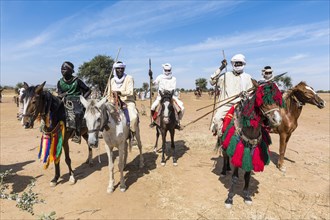 Colourful horse riders at a Tribal festival