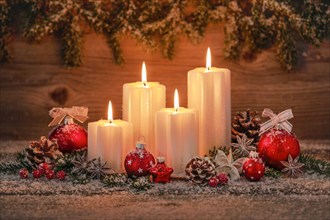 Natural advent decoration with 4 burning candles
