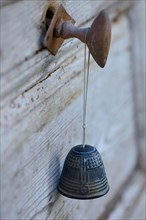 BELL on old wooden door