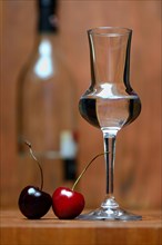 Glass of cherry brandy with cherries