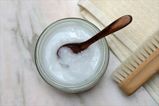 Coconut oil with wooden spoon