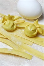 Tagliatelle and filled dough pearls