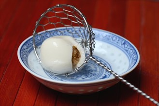 Boiled sticky rice balls with peanut filling
