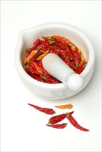 Dried chilli peppers in grating bowl