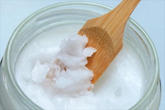 Coconut oil with bamboo spatula