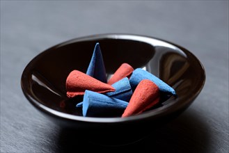 Different incense cones in bowl