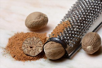 Nutmegs and nutmeg powder with grater