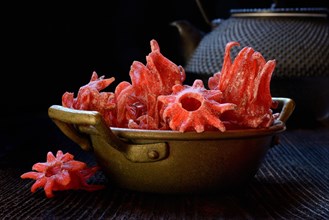 Candied hibiscus flowers in shell