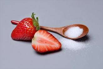 Strawberries and sugar with spoon