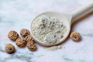 Tigernuts and tigernut flour in cooking spoon