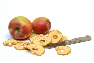 Dried apple slices with knife