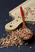 Buckwheat in wooden spoon