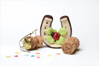 Horseshoes made of marzipan and champagne corks
