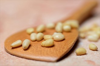 Cedar seeds with cooking spoon