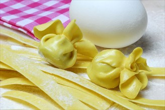 Tagliatelle and filled dough pearls