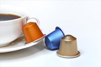 Coffee capsules and coffee cup with coffee