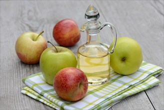 Carafe with apple vinegar and apples