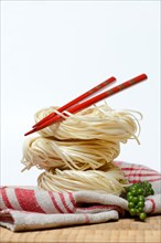 Chinese Yangchun noodles with chopsticks and green pepper