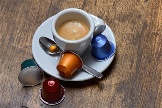 Coffee capsules and coffee cup with espresso