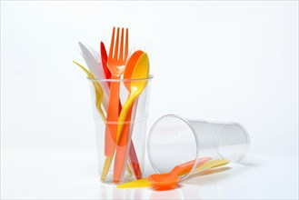 Plastic cups and plastic cutlery