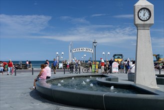 Beach promenade with clock and fountain