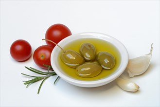 Green olives in shell with olive oil