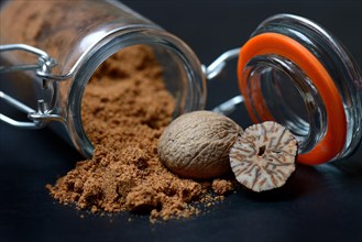 Nutmegs and nutmeg powder in glass containers