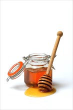 Honey in jars and honey spoon